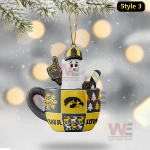Snowman ornament in Iowa patterned cup holding foam finger and candy cane hanging from snowy branch!