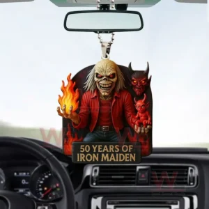 Iron Maiden 50 Years 3D Car Hanging Ornament 4 Iron Maiden anniversary rearview mirror ornament hanging inside a car showing Eddie holding a flame with demon figures behind and a plaque reading fifty years of Iron Maiden.