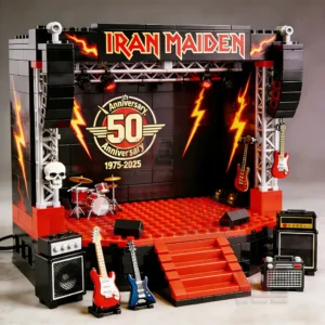 A block built stage with Iron Maiden branding lightning graphics and various musical instruments arranged around a fiftieth anniversary emblem!