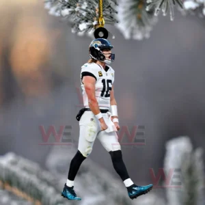 Jacksonville Jaguars player wearing number sixteen in a white uniform walks with teal cleats under a gold ornament string against a snowy blurred background.