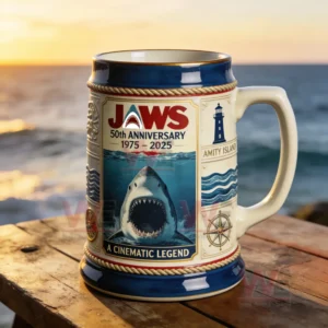 Jaws themed commemorative beer stein with a great white shark design displayed by the ocean at sunset!