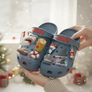 Blue Jaws themed Christmas clogs with ocean and shark charms held in a festive room!
