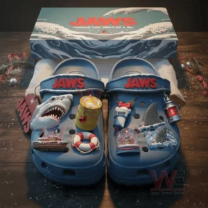 Jaws Shark Christmas Crocs Clogs with Charms 4 Blue Jaws themed clogs with shark and ocean charms arranged inside a decorative box!