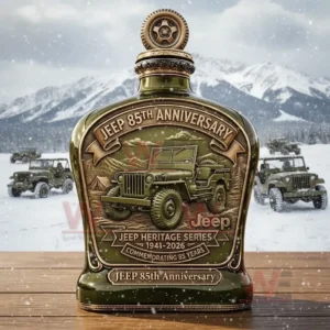 Jeep heritage anniversary bottle in front of snowy mountains with off road vehicles in the distance!