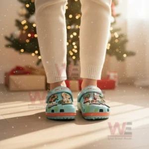 Turquoise Jimmy Buffett Christmas clogs with tropical charms worn in a festive room!