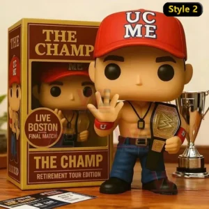 John Cena Farewell Tour 2025 Pop Vinyl Figure 4 John Cena style championship collectible figure with red cap and title belt displayed next to a retirement tour edition box with a trophy on a tabletop!