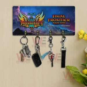 Journey themed wall key holder with galaxy artwork and multiple hooks displayed above a wooden table in a cozy interior!