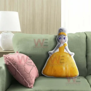 Rabbit princess pillow in a yellow gown standing on a green sofa in a cozy living room!