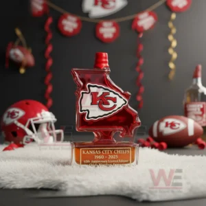 A Missouri shaped Chiefs bottle placed on a fluffy white surface with football items and celebratory decor behind it!