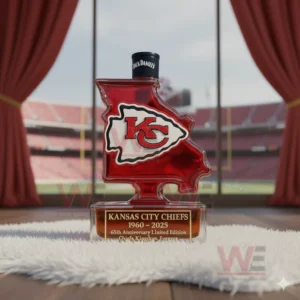 Kansas City Chiefs 1960-2025 65th Anniversary Custom Whiskey Bottle 4 A Missouri shaped Chiefs bottle positioned on a fluffy surface with the field and stands visible through tall windows!