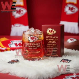 Kansas City Chiefs 65th Anniversary 4x Super Bowl Champions Whiskey Glass 7 A Chiefs sixty fifth season glass with orange ice beside a red team box and fan accessories!