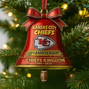 Kansas City Chiefs 65th Anniversary Chiefs Kingdom Bell Ornament 5 A close up of a red Chiefs anniversary bell ornament hanging on a Christmas tree!