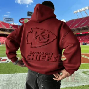 Back view of a red Kansas City Chiefs hoodie with embossed logo worn on a football field!
