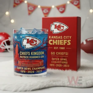 Kansas City Chiefs Patrick Mahomes Era Super Bowl Champions Whiskey Glass 5 Kansas City Chiefs glass with blue iced drink beside a red box in a room decorated with team themed triangular banners!
