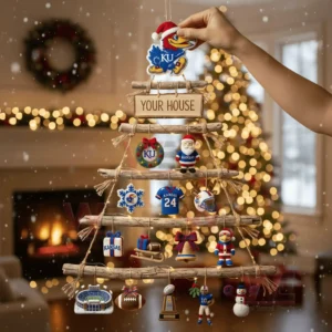 A person holding a rustic wooden branch Christmas wall tree decorated with Kansas Jayhawks themed ornaments in a festive living room!