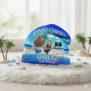 Blue Kenny Chesney beach themed beanie with Las Vegas Sphere design on a white fluffy surface.