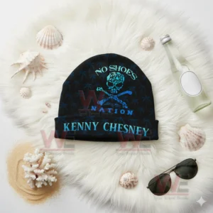 Kenny Chesney Sphere Las Vegas Beanie Hat cap 10 Black Kenny Chesney No Shoes Nation beanie with blue skull design on white furry surface.