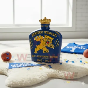 A blue Wildcats bottle with a yellow wildcat graphic stands on a fluffy white rug with basketball themed items around it!