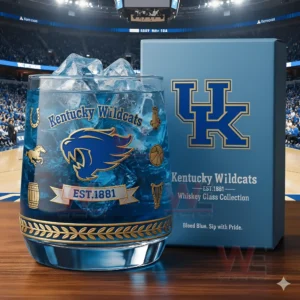 Kentucky Wildcats whiskey glass with ice beside a blue box in a packed indoor arena!