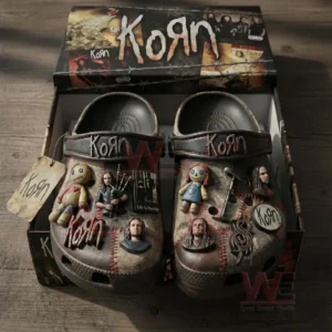 Dark clogs inside a branded box decorated with band inspired charms figures symbols and album related details!