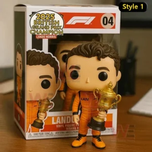 Lando Norris themed Formula One collectible figure in an orange suit holding a gold trophy displayed beside a 2025 British Grand Prix Champion box!