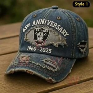 Blue distressed denim Raiders anniversary baseball cap with embroidered logo and vintage worn details resting on wood!