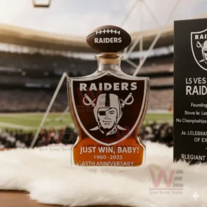 Raiders themed glass whiskey bottle displayed with a stadium backdrop!