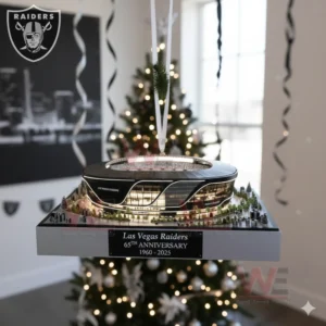 Las Vegas Raiders stadium anniversary ornament hanging on a Christmas tree inside a room decorated with Raiders memorabilia!