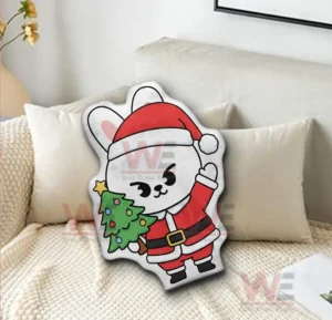 White cartoon rabbit shaped pillow in santa outfit displayed on a white bed!