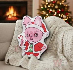 Cartoon pig shaped pillow in santa outfit in a warm christmas living room setting!