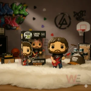 Brad Delson figure with a red guitar displayed beside its box in a music themed setup.