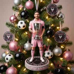 Soccer player ornament in pink uniform holding a trophy on a Christmas tree!