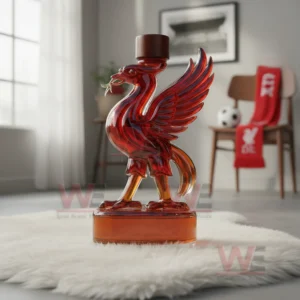Red bird shaped glass bottle on a white rug inside a modern room with chair and wall decor!