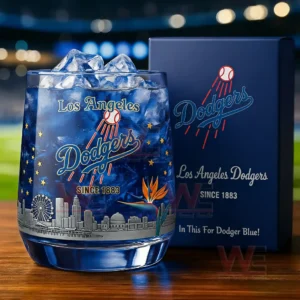 Los Angeles Dodgers themed whiskey glass with blue drink ice cubes and decorative design next to a branded collector box!
