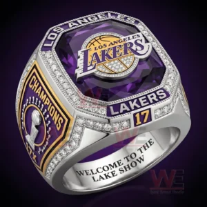 Close up view of a Los Angeles Lakers championship ring with purple gemstone gold logo and diamond details!