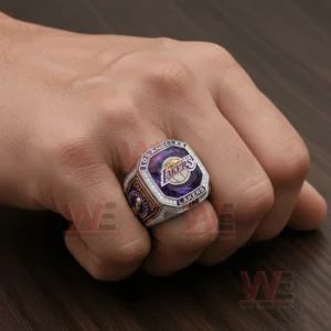 Los Angeles Lakers championship ring worn on a hand with purple gold and diamond styling!