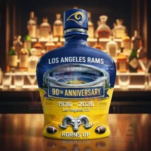 Los Angeles Rams Horns Up 90th Anniversary 1936-2026 Whiskey Bottle 4 Los Angeles Rams blue and gold 90th anniversary whiskey bottle with Rams horn logo cap stadium artwork and Horns Up text displayed on a bar counter!