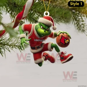A holiday ornament of a green figure in a red uniform holding a basketball with a cardinal logo while hanging from a Christmas tree branch!