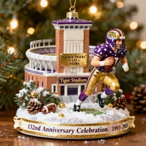 A Christmas ornament of Tiger Stadium with an LSU football player and a banner celebrating one hundred thirty two years from eighteen ninety three to twenty twenty five!