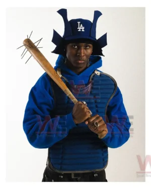 Magnetic Kabuto Attachments 19 Model wearing a blue samurai style hat and holding a wooden weapon in a strong stance!