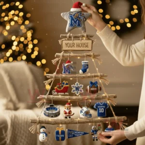 A person holding a rustic wooden branch Christmas wall tree decorated with Memphis Tigers themed ornaments in a festive living room!