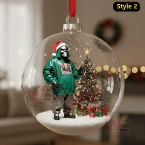 MF DOOM Rapper Christmas Ornament 11 Transparent bauble featuring a masked figure in a green hoodie beside a lit Christmas tree and presents!