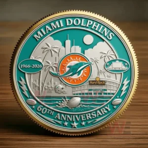 Miami Dolphins 60th Anniversary 1966-2026 Faithful to South Florida Coin 6 A round Miami Dolphins anniversary coin with teal gold and silver details rests on a wooden table!