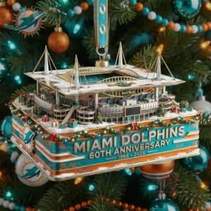 A miniature Miami Dolphins stadium ornament featuring structural details and anniversary text suspended among teal orange and white Christmas decorations!