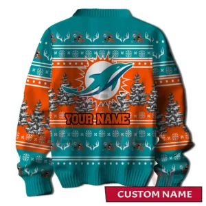 A back view of a teal and orange holiday sweater with a large dolphin emblem customizable name area winter trees and decorative festive patterns!