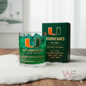 Miami Hurricanes anniversary glass with green iced drink beside a dark green box showing team logo and championship information!