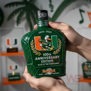 Hands presenting a green commemorative whiskey bottle with a collegiate design indoors!