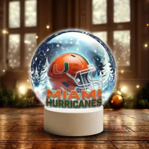 Miami Hurricanes LED Snow Globe Night Light Christmas Ornament 6 Snow globe style display featuring a Miami Hurricanes helmet on a white base in a winter scene!