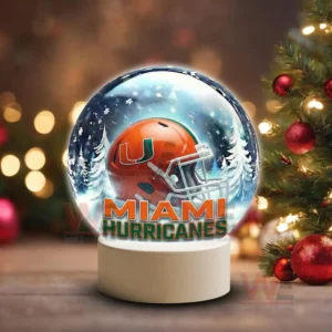 Miami Hurricanes LED Snow Globe Night Light Christmas Ornament 7 Holiday themed snow globe with Miami Hurricanes helmet on a white base near Christmas decorations!