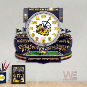 Michigan Wolverines stadium style wall clock with crowd details mascot figure and team branding for sports themed decor!